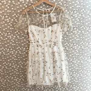 NWT boutique floral dress. Size small